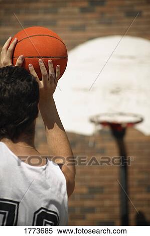 Basketball player taking aim View Large Photo Image Stock Photography - Basketball player taking aim. Fotosearch