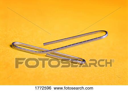 Stock Photograph - Bent paperclip. Fotosearch