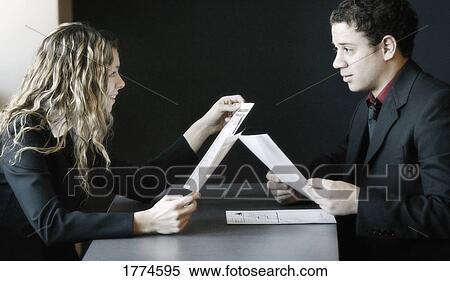 Business people sitting at table View Large Photo Image Stock Photography - Business people sitting at table. Fotosearch