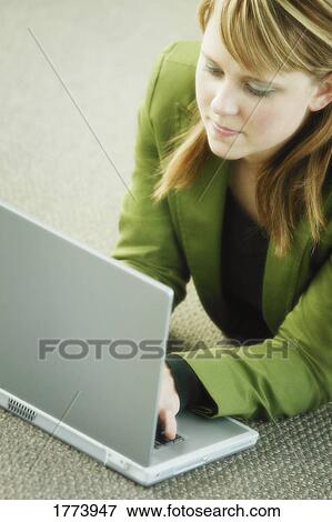 Stock Photo - Businesswoman working on laptop. Fotosearch