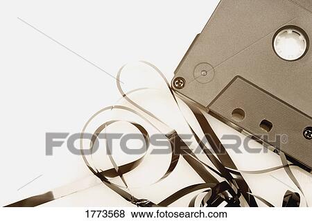 Stock Photo - Cassette with tape pulled out. Fotosearch