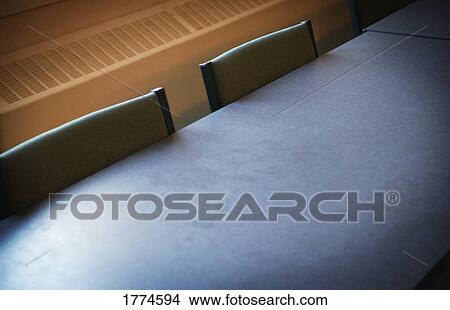 Chairs pushed into table View Large Photo Image Picture - Chairs pushed into table. Fotosearch