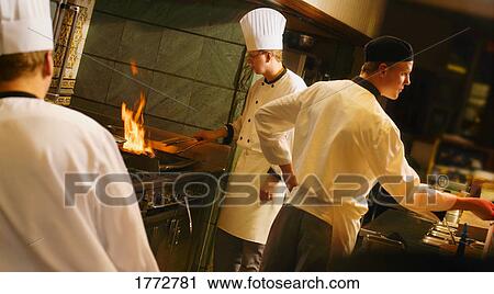 Chefs and cooks at work View Large Photo Image Stock Image - Chefs and cooks at work. Fotosearch