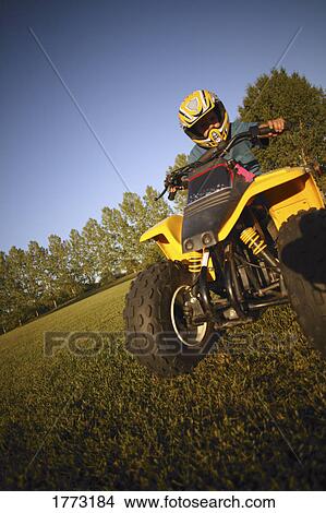 child on quad bike View Large Photo Image Picture - child on quad bike. Fotosearch