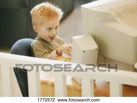 Child working on computer View Large Photo Image Stock Image - Child working on computer. Fotosearch