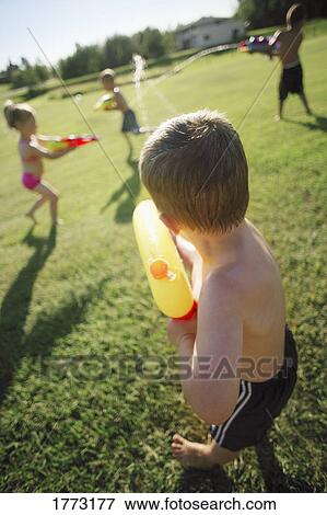 Children playing with water pistols View Large Photo Image Stock Photo - Children playing with water pistols. Fotosearch