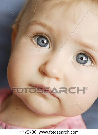 Stock Image - Close up of baby's face. Fotosearch