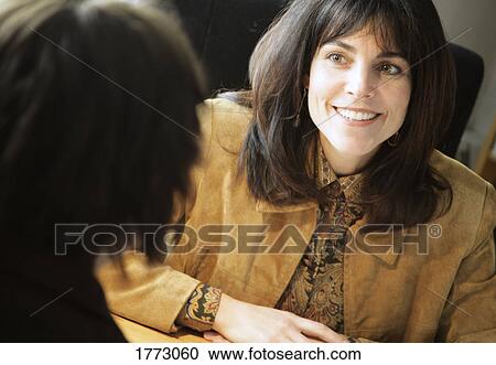 Conversation with a professional woman View Large Photo Image Stock Image - Conversation with a professional woman. Fotosearch