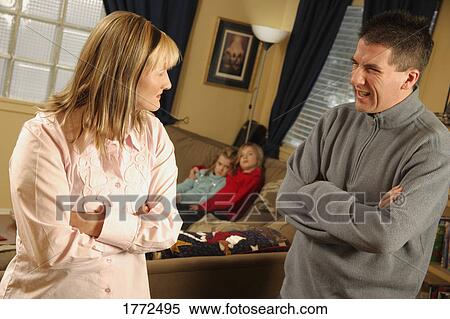 Couple arguing in front of children View Large Photo Image Stock Photography - Couple arguing in front of children. Fotosearch