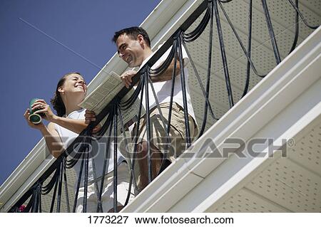 Couple enjoying the sun View Large Photo Image Stock Photo - Couple enjoying the sun. Fotosearch