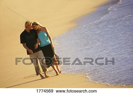 Stock Photo - Couple on beach. Fotosearch