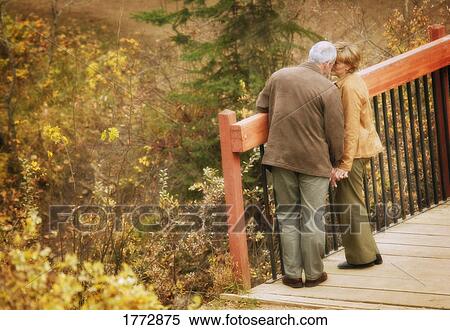 Couple on bridge View Large Photo Image Stock Photography - Couple on bridge. Fotosearch