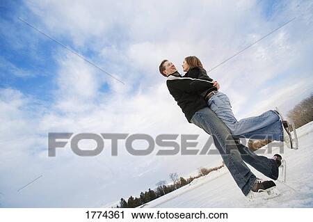 Couple skating View Large Photo Image Stock Image - Couple skating. Fotosearch