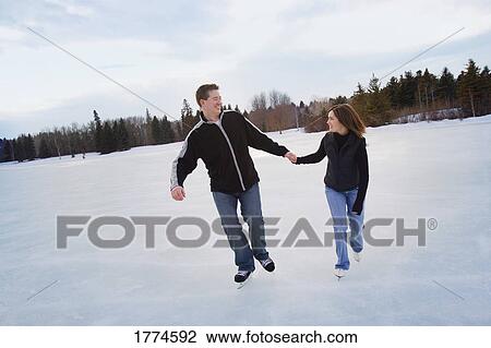 Couple skating View Large Photo Image Stock Image - Couple skating. Fotosearch