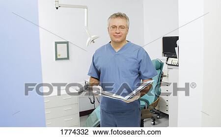 Dentist in his surgery View Large Photo Image Stock Image - Dentist in his surgery. Fotosearch