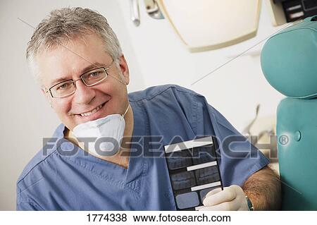 Stock Photo - Dentist in his surgery. Fotosearch