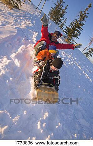 Family on toboggan View Large Photo Image Stock Photograph - Family on toboggan. Fotosearch