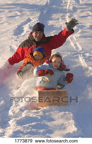 Family tobogganing View Large Photo Image Stock Photo - Family tobogganing. Fotosearch