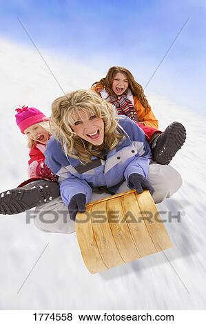 Family tobogganing View Large Photo Image Stock Photo - Family tobogganing. Fotosearch