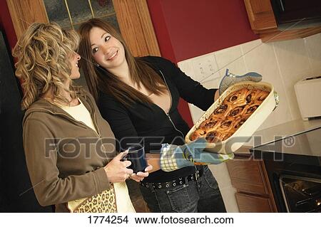 Picture - Food taken out of oven. Fotosearch