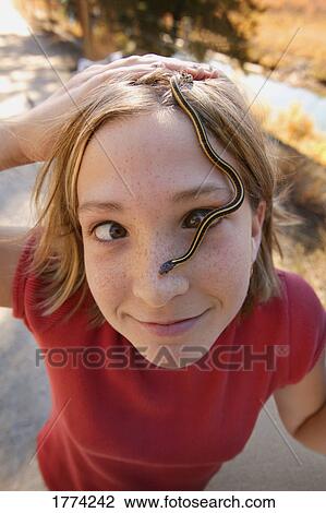 Girl with snake on face View Large Photo Image Stock Image - Girl with snake on face. Fotosearch