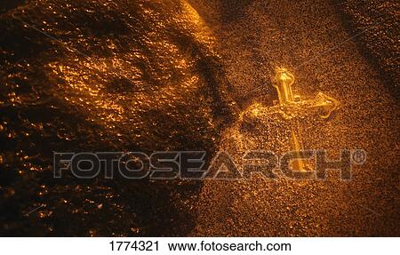 Stock Image - Golden cross. Fotosearch
