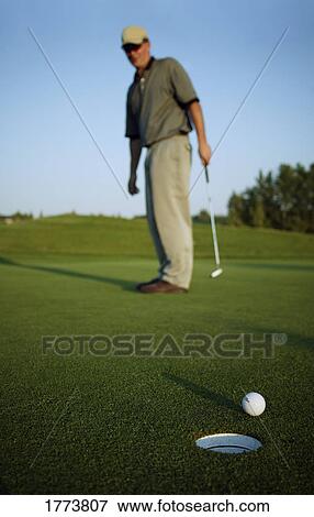 Golfer missed the hole View Large Photo Image Stock Photo - Golfer missed the hole. Fotosearch