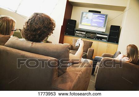 Group hanging out watching TV View Large Photo Image Stock Image - Group hanging out watching TV. Fotosearch
