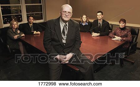 Group of people in a meeting room View Large Photo Image Stock Photo - Group of people in a meeting room. Fotosearch