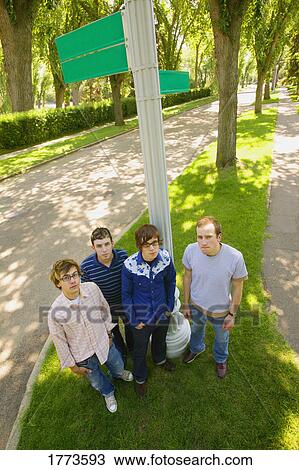 Group of teenagers at street sign View Large Photo Image Stock Image - Group of teenagers at street sign. Fotosearch