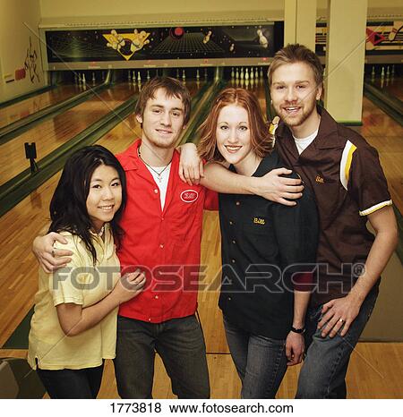 Group of teens at the bowling alley View Large Photo Image Stock Photo - Group of teens at the bowling alley. Fotosearch