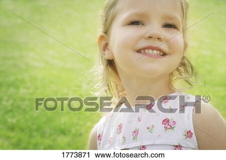 Stock Image - Little girl in summer dress. Fotosearch