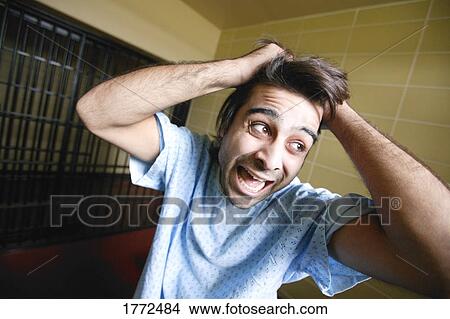 Man exhibiting bizarre behavior View Large Photo Image Picture - Man exhibiting bizarre behavior. Fotosearch