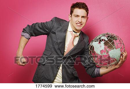 Stock Photo - Man holding globe. Fotosearch
