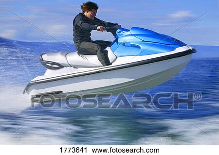 Man on jet ski View Large Photo Image Stock Image - Man on jet ski. Fotosearch