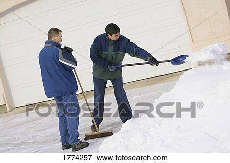 Man shoveling driveway View Large Photo Image Stock Photo - Man shoveling driveway. Fotosearch