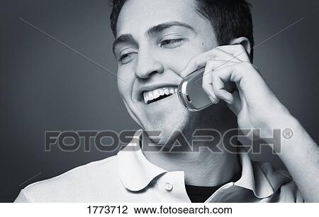 Man talking on cell phone View Large Photo Image Stock Image - Man talking on cell phone. Fotosearch