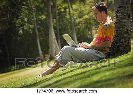 Stock Photograph - Man working out of doors. Fotosearch