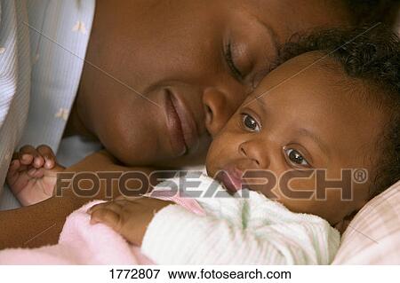 Mother and baby sleeping View Large Photo Image Stock Photo - Mother and baby sleeping. Fotosearch