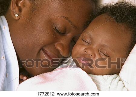 Stock Image - Mother and daughter sleeping. Fotosearch