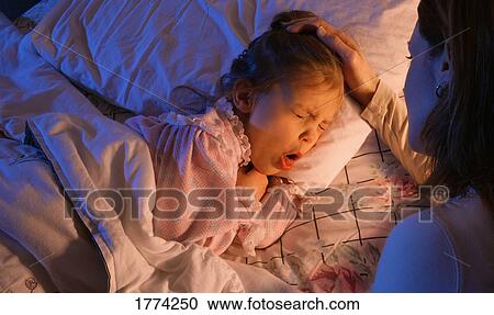 Mother beside sick child View Large Photo Image Stock Image - Mother beside sick child. Fotosearch