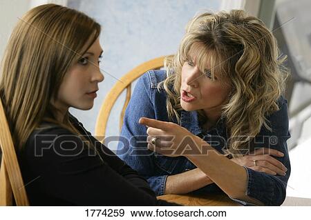 Mother talking to daughter View Large Photo Image Stock Photo - Mother talking to daughter. Fotosearch