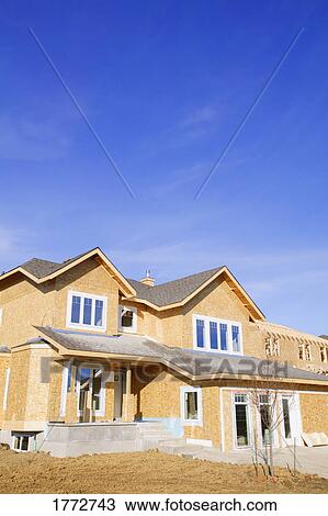 Stock Image - Newly constructed house. Fotosearch