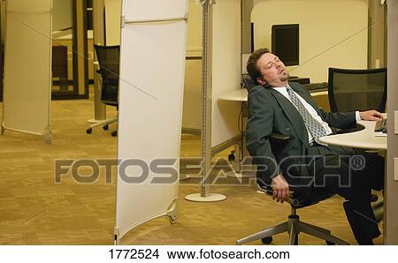 Office worker asleep at his desk View Large Photo Image Picture - Office worker asleep at his desk. Fotosearch