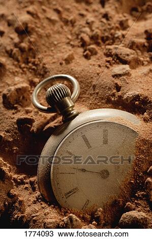Old pocket watch buried View Large Photo Image Stock Image - Old pocket watch buried. Fotosearch