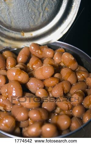 Stock Image - Open can of baked beans. Fotosearch