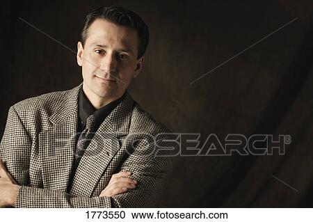 Stock Image - Portrait of adult Dark haired man. Fotosearch
