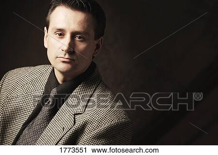 Portrait of serious dark-haired adult man View Large Photo Image Stock Image - Portrait of serious dark-haired adult man. Fotosearch