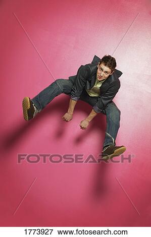 Portrait of teenager jumping View Large Photo Image Stock Photo - Portrait of teenager jumping. Fotosearch