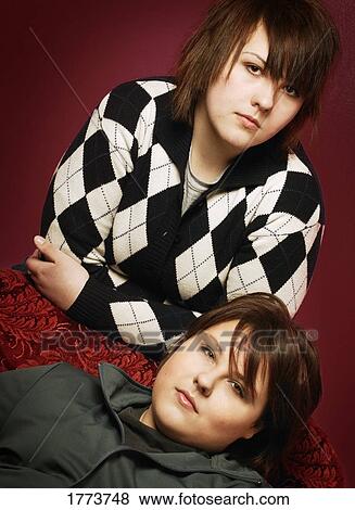 Stock Photo - Portrait of twins. Fotosearch
